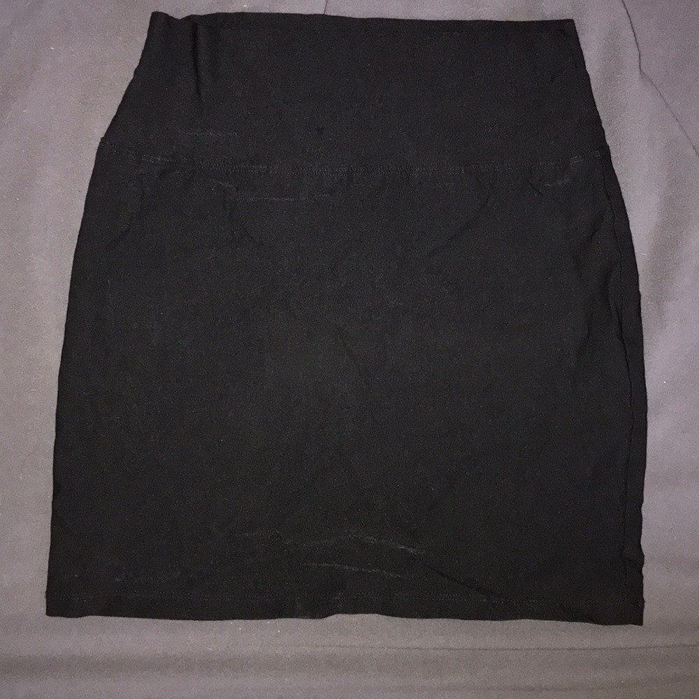 Black pencil type mini skirt.